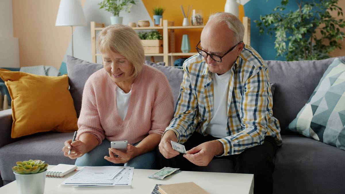 Illustration showing overwhelmed parents surrounded by bills